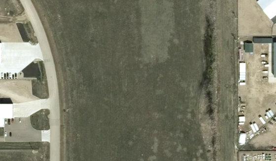 Satellite view of PLAN 1524312 BLOCK 2 LOT 26 in City of Lloydminster, with the parcel boundary outlined