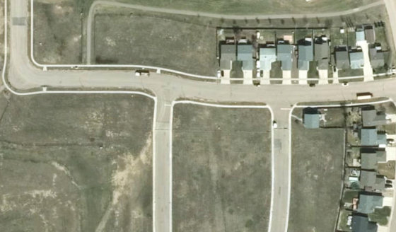 Satellite view of PLAN 1522663 BLOCK 20 LOT 18 in City of Lloydminster, with the parcel boundary outlined