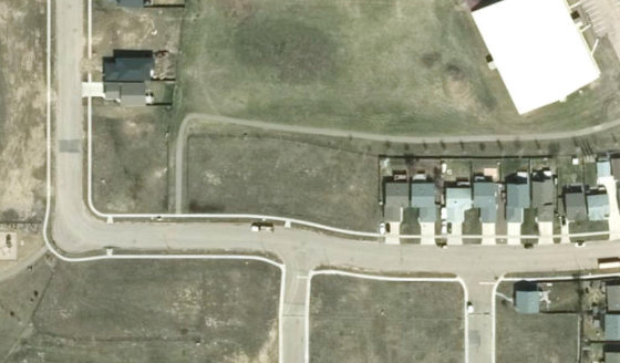 Satellite view of PLAN 1522663 BLOCK 6 LOT 84 in City of Lloydminster, with the parcel boundary outlined
