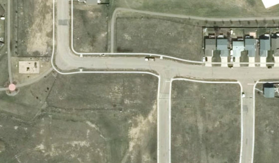 Satellite view of PLAN 1522663 BLOCK 18 LOT 49 in City of Lloydminster, with the parcel boundary outlined