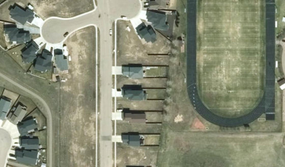Satellite view of PLAN 1522663 BLOCK 6 LOT 65 in City of Lloydminster, with the parcel boundary outlined