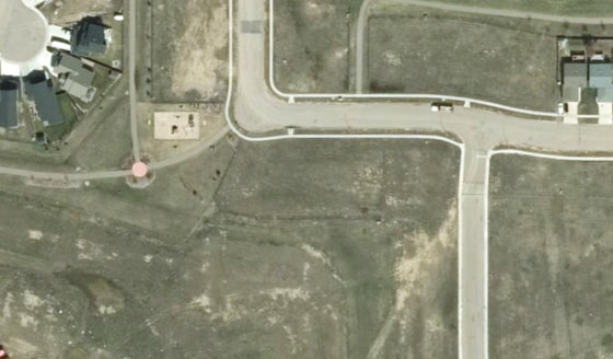 Satellite view of PLAN 1522663 BLOCK 18 LOT 52 in City of Lloydminster, with the parcel boundary outlined
