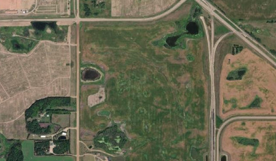 Satellite view of NW-25-46-20-W4 in City of Camrose, with the parcel boundary outlined