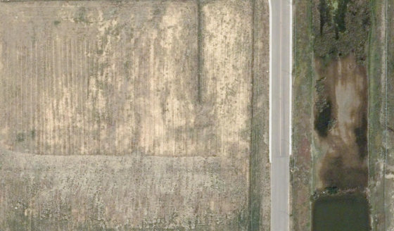 Satellite view of 4130-32 St N in City of Lethbridge, with the parcel boundary outlined