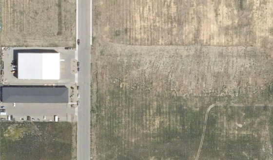 Satellite view of 3991-30 St N in City of Lethbridge, with the parcel boundary outlined