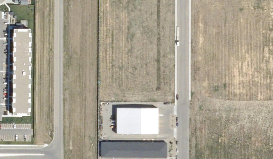 Satellite view of 4132-30 St N in City of Lethbridge, with the parcel boundary outlined