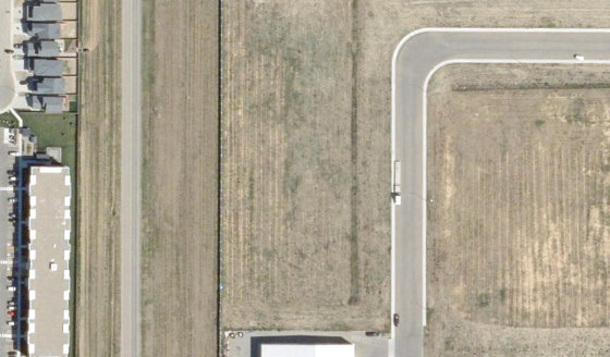 Satellite view of 4160-30 St N in City of Lethbridge, with the parcel boundary outlined