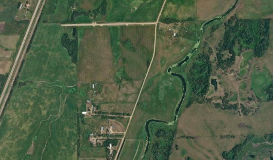 Satellite view of NE-15-43-25-W4 in Ponoka County, with the parcel boundary outlined