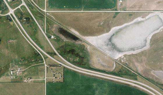 Satellite view of NW-11-16-28-W4 in Municipal District of Willow Creek No. 26, with the quarter section this parcel sits inside outlined