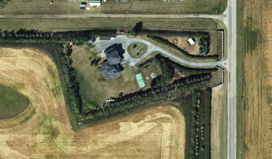 Satellite view of PLAN 0214173 BLOCK 1 LOT 1 in Rocky View County, with the parcel boundary outlined
