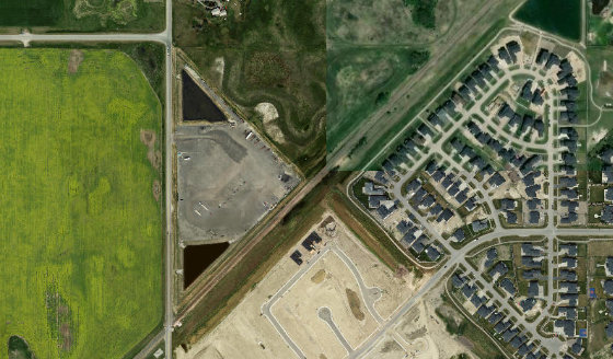 Satellite view of PLAN 1110135 BLOCK 1 LOT 1 in Rocky View County, with the parcel boundary outlined