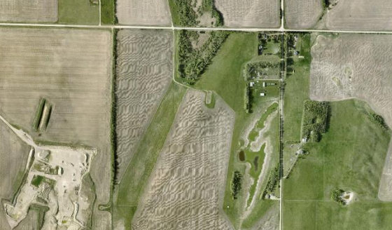 Satellite view of NE-21-37-28-W4 in Red Deer County, with the quarter section this parcel sits inside outlined