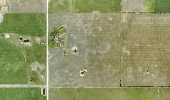 Satellite view of SW-12-37-2-W5 in Red Deer County, with the parcel boundary outlined