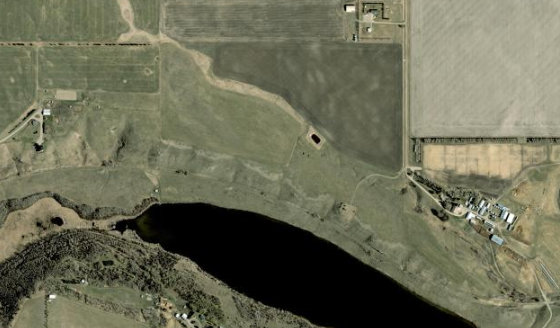Satellite view of SE-27-28-2-W5 in Rocky View County, with the parcel boundary outlined