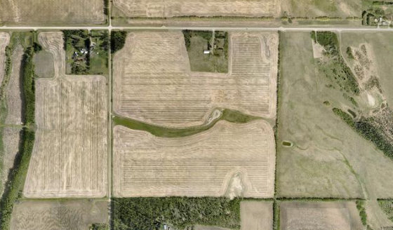 Satellite view of NW-24-34-3-W5 in Red Deer County, with the quarter section this parcel sits inside outlined