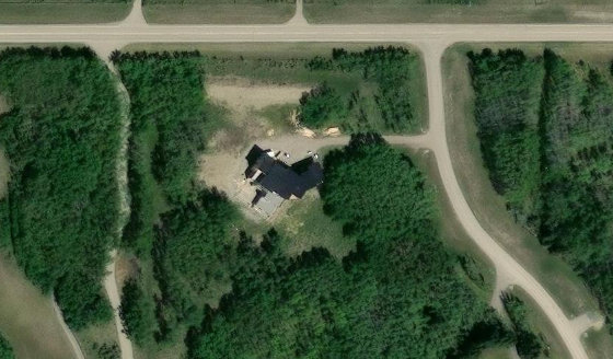 Satellite view of PLAN 2210191 BLOCK 1 LOT 1 in Rocky View County, with the parcel boundary outlined