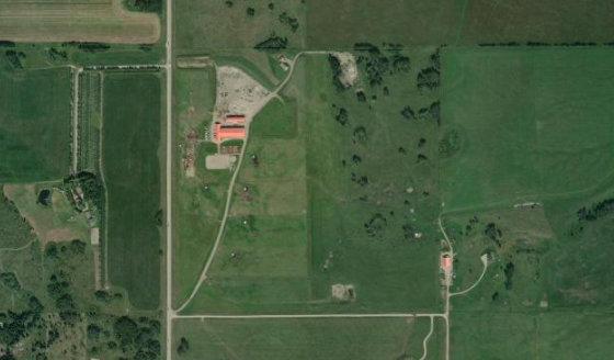 Satellite view of SW-23-27-4-W5 in Rocky View County, with the parcel boundary outlined