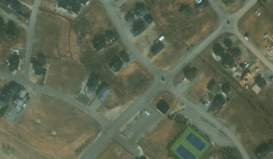 Satellite view of CONDO PLAN 1412822 UNIT 223 in Rocky View County, with the parcel boundary outlined